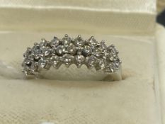 Jewellery: White metal three row half hoop ring set with twenty-eight brilliant cut diamonds,