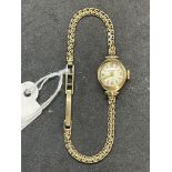 Ladies wristwatch by J. W. Benson of London. Case cover stamped 375 gold by winder. Bracelet strap