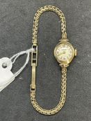 Ladies wristwatch by J. W. Benson of London. Case cover stamped 375 gold by winder. Bracelet strap