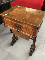 19th cent. Mahogany sewing table with inlaid oval motif above a drawer for sewing requisites. 18ins.