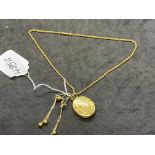 Jewellery: Yellow metal oval hinged locket on a 16ins rope link chain, plus a pair of ball and chain