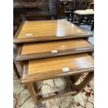 Mid 20th cent. G-Plan teak effect three table nest of tables. The largest 19½ins. x 19½ins. x