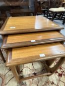 Mid 20th cent. G-Plan teak effect three table nest of tables. The largest 19½ins. x 19½ins. x
