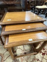 Mid 20th cent. G-Plan teak effect three table nest of tables. The largest 19½ins. x 19½ins. x