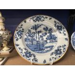 18th cent. Dutch Delft charger, blue central panel garden and trees, outer border fine floral