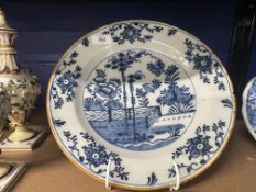 18th cent. Dutch Delft charger, blue central panel garden and trees, outer border fine floral