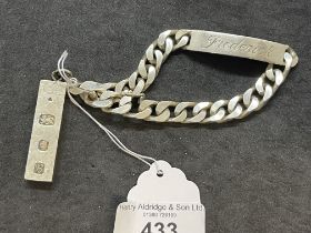 Hallmarked Jewellery: Silver identity bracelet engraved front and back and a silver ingot.