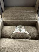 Hallmarked Jewellery: Platinum ring rub over set with a single cushion shape diamond, estimated