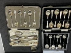Hallmarked Silver: Boxed coffee spoons, 2 pairs of sugar nips, a napkin ring and 4 teaspoons.