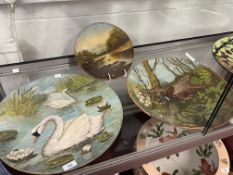 Torquay Pottery: Long Park terracotta chargers painted by W.G. Howard of swans and pheasants, plus