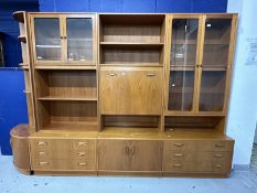 Mid 20th cent. G-Plan teak effect wall units including glazed display cabinet over three drawers,