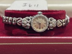 Watches: Ladies platinum head diamond set Omega cocktail watch on plated bracelet.