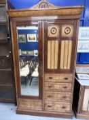 Arts & Crafts: Burr maple single wardrobe with stylised mons. 46ins. x 84½ins. x 18½ins. With