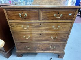 Georgian mahogany two over three chest of drawers of modest proportions on bracket supports with