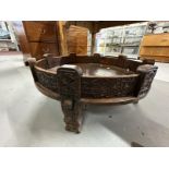 20th cent. Traditional Indian Chakki low table, the sides and supports carved profusely with