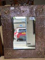 Arts & Crafts beaten copper mirror in the style of Liberty's. 13ins. x 12ins.