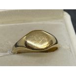 Jewellery: Yellow metal signet ring with 9.5mm x 8mm oval head, tests as 18ct gold. Ring size K.