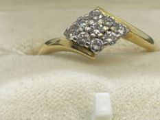 Hallmarked Jewellery: 18ct gold set with nine diamonds as a diamond shaped cluster, estimated weight