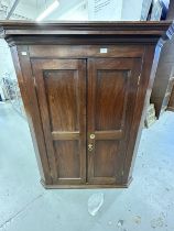 18th cent. Oak peg jointed twin door corner cupboard with original furniture and lock, the doors