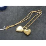 Hallmarked Jewellery: 9ct gold barley corn link chain with two heart lockets attached. Length 18ins.