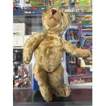 Toys: Merry Weather 1950 Teddy bear, glass eyes, 17¼ins tall very well loved.