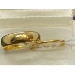 Hallmarked Jewellery: 22ct gold plain 5.5mm band, size L½. Weight 7.8g. Plus a 22ct gold keeper ring