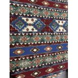 Carpets/Hangings: Late 19th/early 20th cent. Possibly Ottoman multicoloured ground, two thin borders