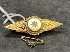 Jewellery: Victorian yellow metal tapering bar brooch centre set with an old cut diamond, tests as