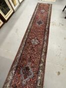 Rugs & Carpets: 20th cent. Runner, Asian style predominantly in red hues with striking blues and