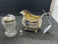 Hallmarked Silver: Milk jug, glass and silver toothpick holder and thimble. Net weight 4.37oz.