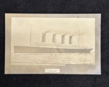 R.M.S. TITANIC: Rare real photo postcard bearing the legend 'She ran into an iceberg in The Atlantic