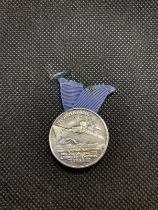 OCEAN LINER: S.S. Normandie souvenir Blue Ribbon pin, circa 1935, a rare piece that was presented to