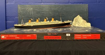 R.M.S. TITANIC: Large diorama depicting the Titanic, iceberg and multiple lifeboats.