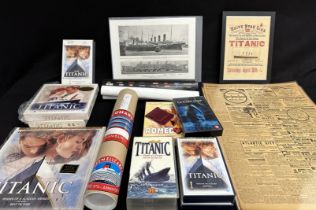 R.M.S. TITANIC: Mixed box of memorabilia including videos, original pages from 1912 newspapers,