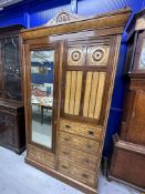 Burr maple single wardrobe with stylised mons. 46ins. x 84½ins. x 18½ins.