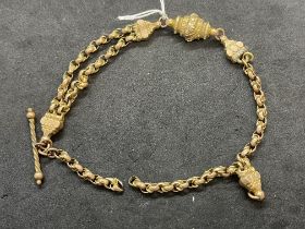 Jewellery: Yellow metal part of a fancy Albert chain, tests as 9ct gold. Length 9ins. 11.8g.