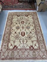 Modern weave rug, ivory colour highlighted with reds, blues and green. 81ins. x 58ins.