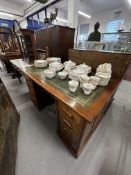 20th cent. Mahogany double pedestal desk, four drawers either side with carved handles, green