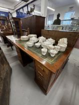 20th cent. Mahogany double pedestal desk, four drawers either side with carved handles, green