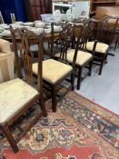 19th cent. Mahogany harlequin set of four dining chairs with carved splat backs.