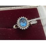 Jewellery: 9ct gold ring central set with an oval cut blue topaz, estimated weight 2.25ct,