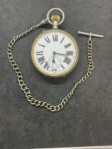Watches: Large 'Goliath' pocket watch and Albert chain, with silver T bar.