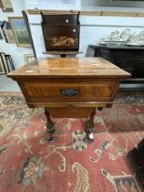 19th cent. Mahogany sewing table with inlaid oval motif above a drawer for sewing requisites. 18ins.