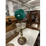 Late 19th/early 20th cent. Pedestal oil lamp, copper base with brass pedestal, clear glass reservoir