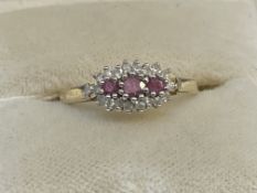 Jewellery: 9ct gold cluster set with three rubies, estimated weight of (3) 0.20ct