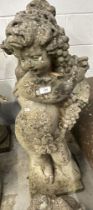 Gardenalia: Reconstituted stone cherub holding the bounty of the seasons (grapes)