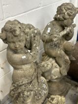 Gardenalia: Reconstituted stone pair of musical cherubs playing instruments, cymbals and flute.