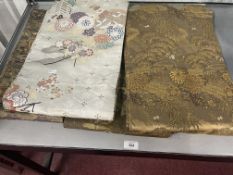 20th cent. Embroidered Japanese obi's of various colours. (4)