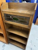 Oak narrow bookcase, stained glass cupboard with shelves below, Derry & Thomas, Kensington label