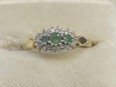 Jewellery: 9ct gold cluster set with three emeralds, estimated weight of (3)0.15ct,